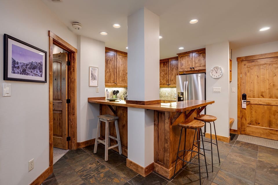 Gather around your rustic kitchen island for morning coffee or evening conversations in this beautifully appointed space.