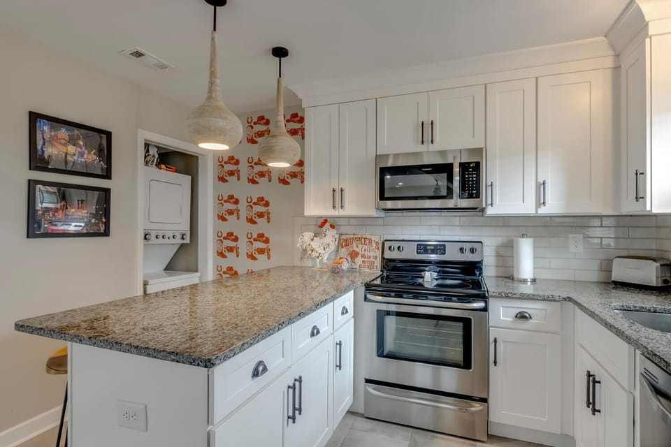 Modern kitchen with stainless appliances and ample counter space
