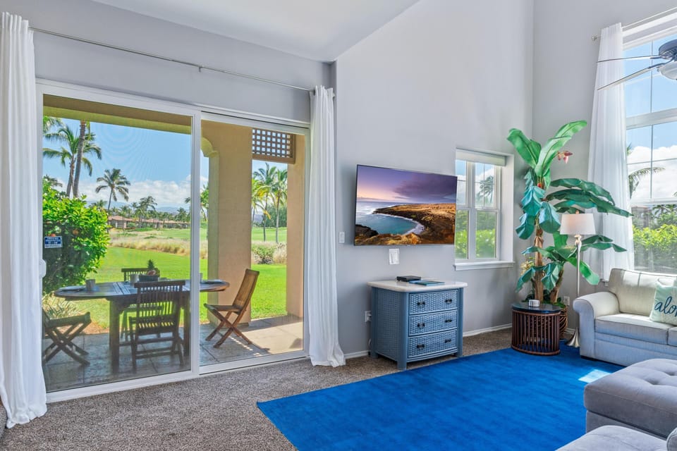 Spacious living room with tall windows