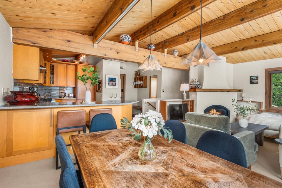 A dining table and bar seating allows for flexibility for dining and working remotely