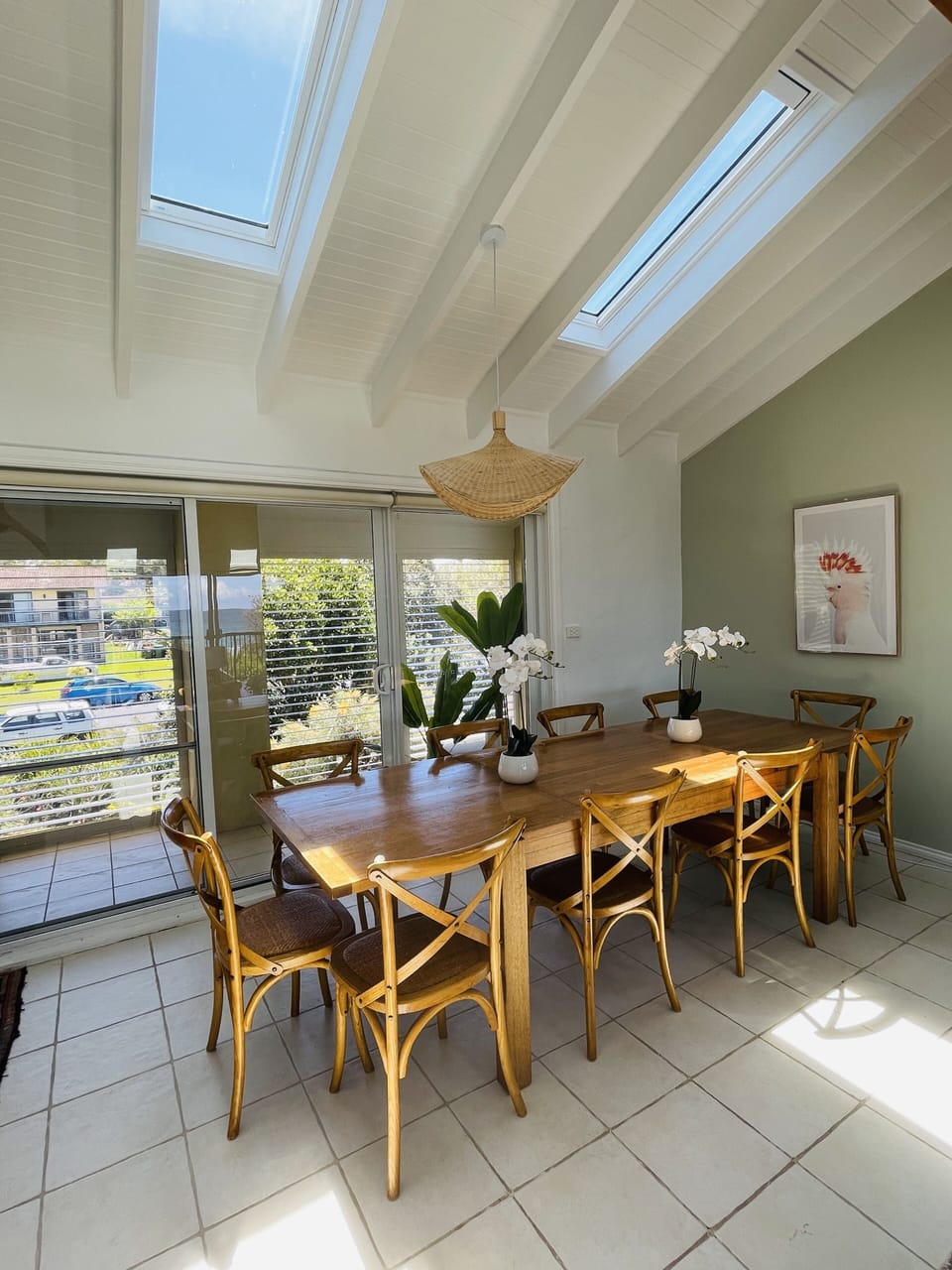 10 seater dinning room table opening up onto west balcony for evening sun.
