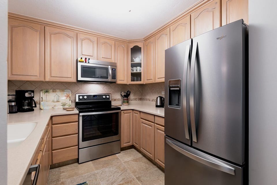 Cook with style in this modern kitchen featuring premium appliances and everything needed for meals at home.