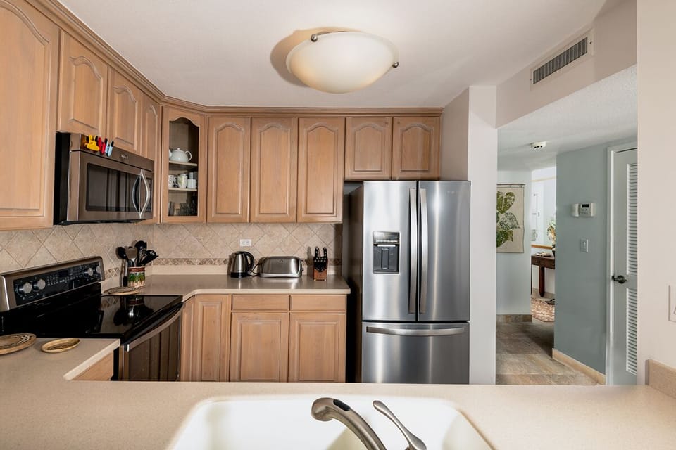 Cook with style in this modern kitchen featuring premium appliances and everything needed for meals at home.