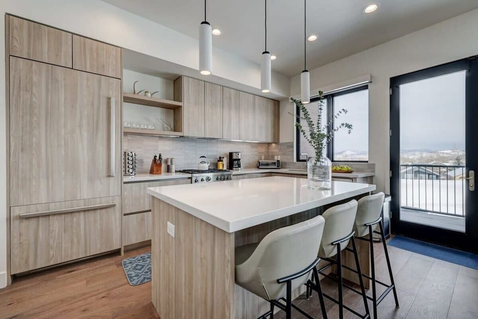 Gourmet chef's kitchen with Bertazonni appliances, breakfast bar
