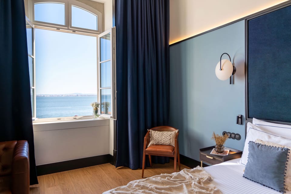 Junior Suite, River View | Minibar, in-room safe, desk, laptop workspace