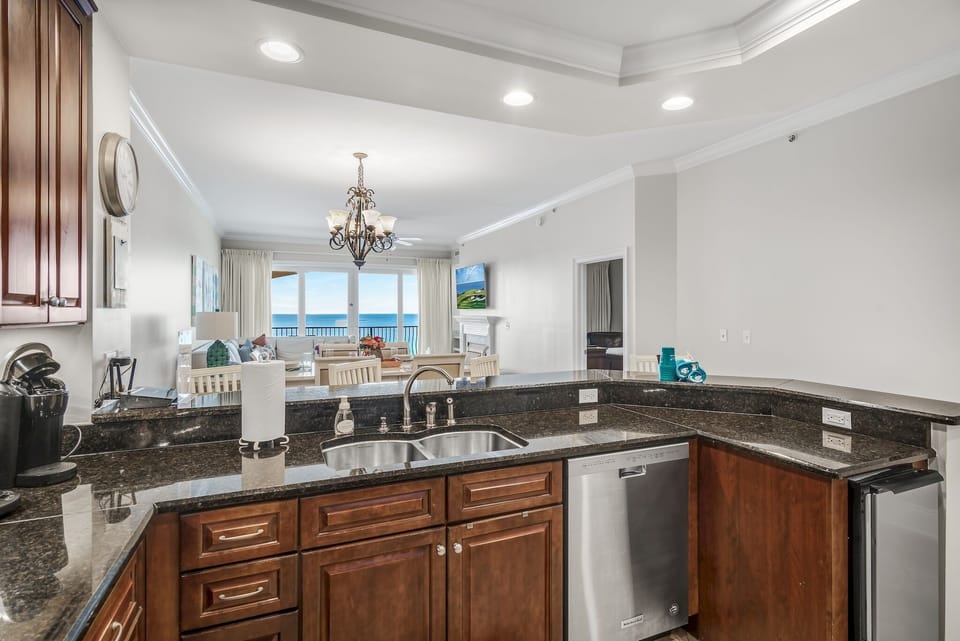 Kitchen with stand alone ice maker - Your Friend at the Beach full stocks each of our Adagio condos with everything you need for the perfect beach vacation. There is a regular coffee maker plus a Keurig in each of our condos- and plenty of bakeware, serving items, and pots/pans. YFAB even includes a crockpot and a robust mixer for those fruity, fun drinks.