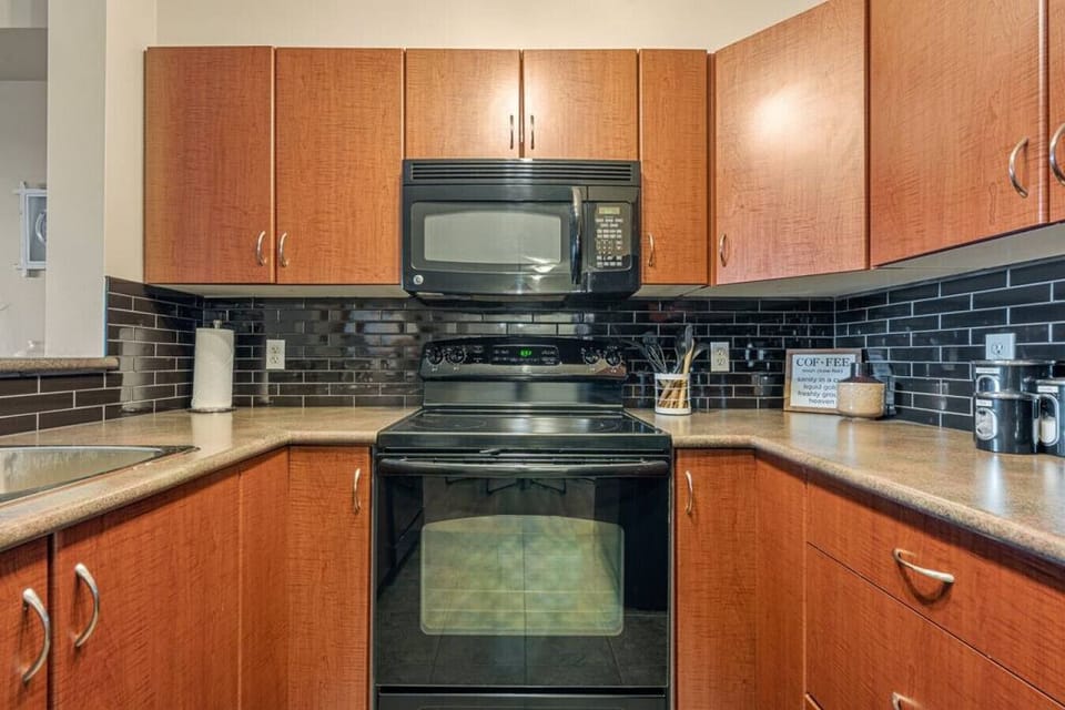 Full kitchen with a drip coffee machine, ground coffee, tea, sugar and basic condiments (ketchup, mustard and relish.)