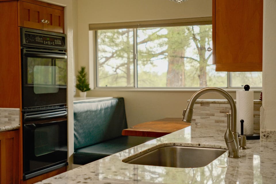 Cook and eat in style as you relax with open backyard views of Snowbowl!

