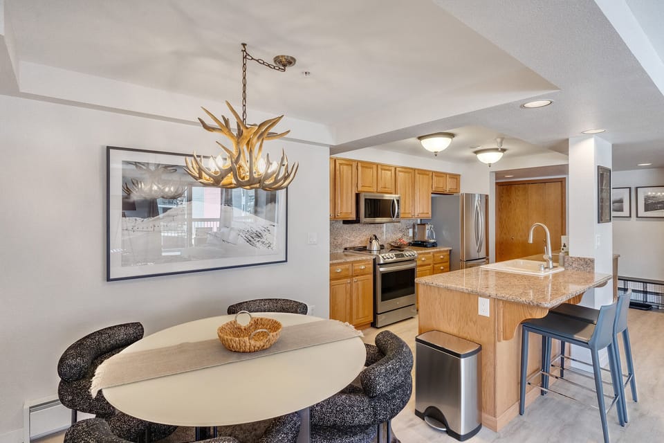 Open concept kitchen and dining room flows into the living room.