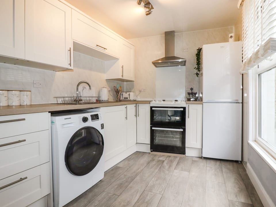 Fridge, electric kettle, toaster, cookware/dishes/utensils