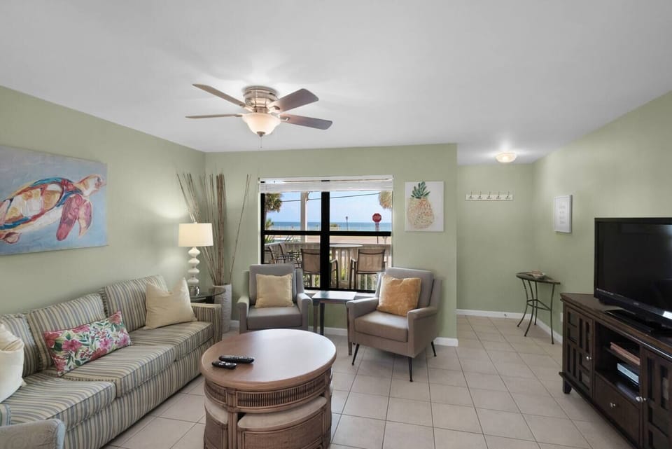 Comfortable living room with plenty of seating, Queen sleeper sofa, 55" Smart TV, beachy decor, and Gulf views!