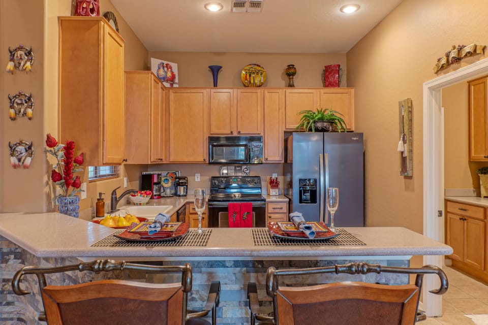 Contemporary kitchen has everything you need to prep and serve your favorite cuisine.