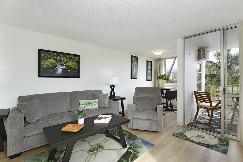 Living Room - Comfy, refreshed living room, dining area, and small lanai with gorgeous views of the Ko'olau mountains and Ala Wai Golf Course