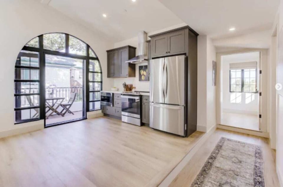 The kitchen has all stainless appliances with direct access to the balcony 