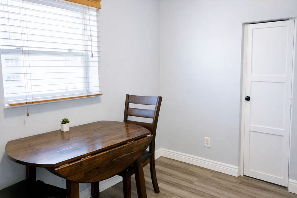 Separate dining room and back entrance with seating for two—perfect for cozy meals together