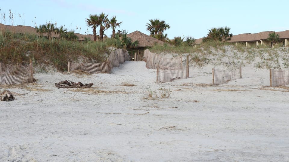 Private boardwalk leading to wide uncrowded beach. 
