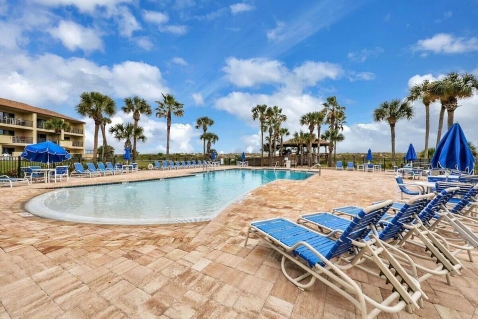 Resort style pool with waterfall feature 