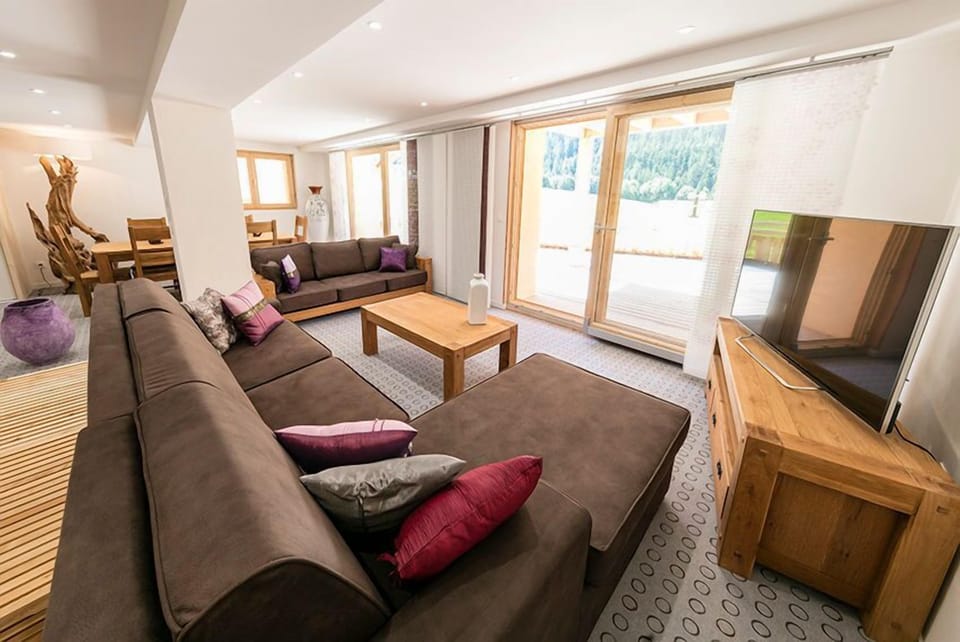 Take a seat on the comfortable sofa in the living area and enjoy a show on TV. Please note photos are representative and actual unit may differ.