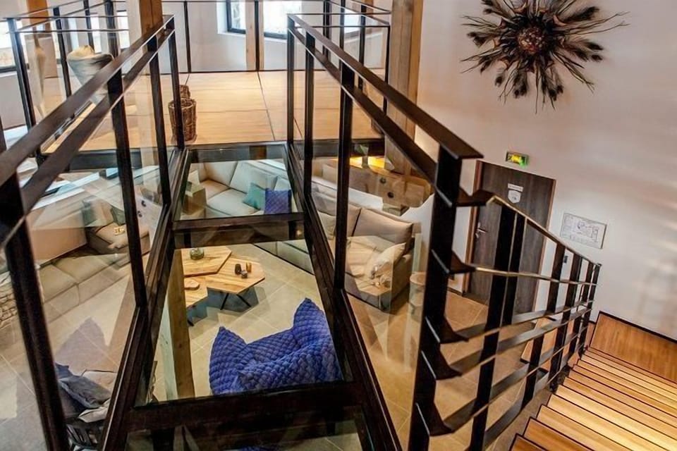You can find a reading room accessible by a glass walkway suspended above the living room!