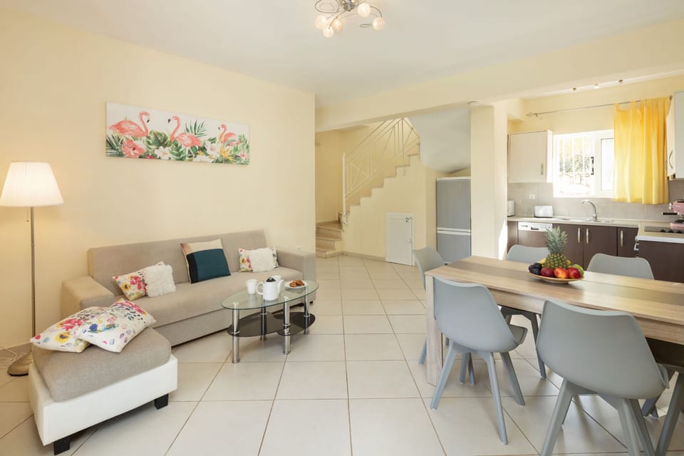 Fully furnished kitchen with sofa and dining table