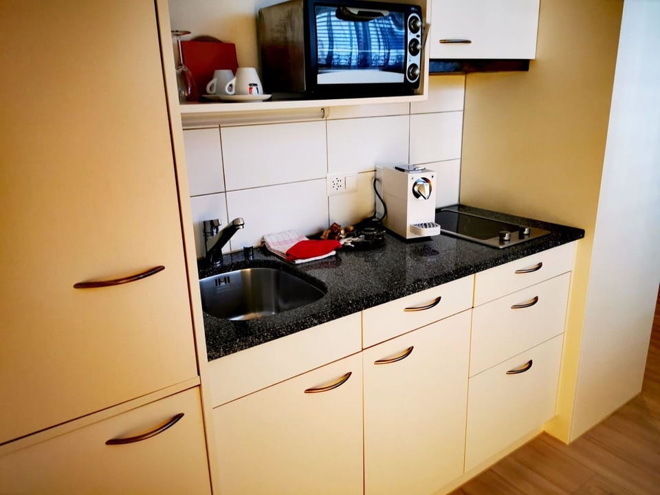 Cabinetry, Furniture, Drawer, Countertop, Interior Design, Kitchen, Wood, Floor, Chest Of Drawers, Home Appliance