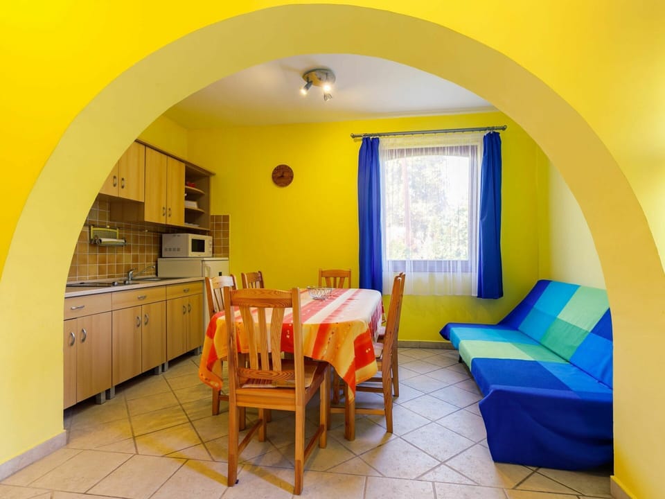 Furniture, Table, Window, Chair, Building, Cabinetry, Orange, Yellow, Interior Design, Wood