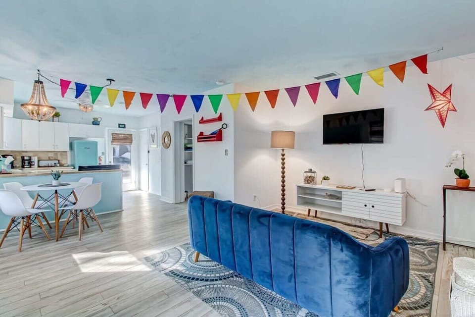 Living room flows into dining and kitchen