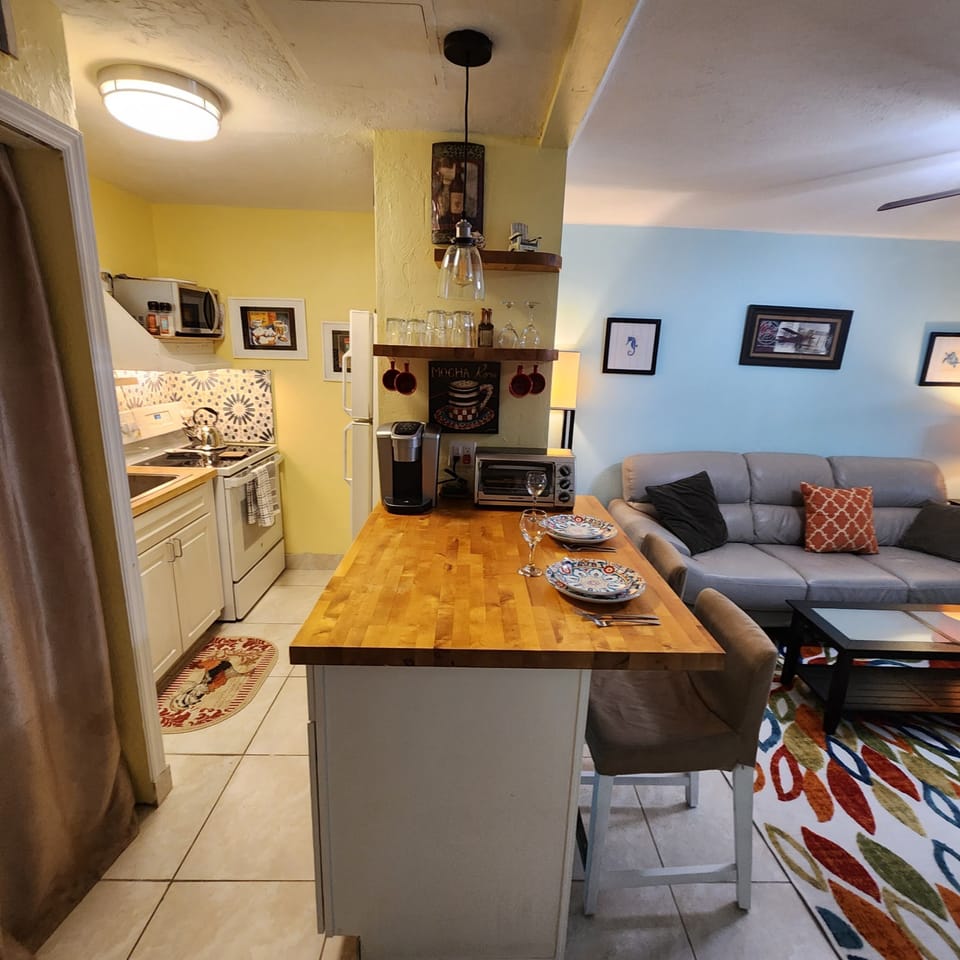 Washer and dryer hidden by curtain.  Breakfast bar
