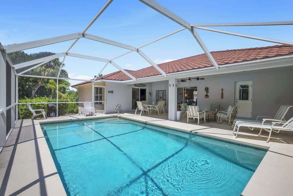 Heated Pool with floats and toys in the garage. 