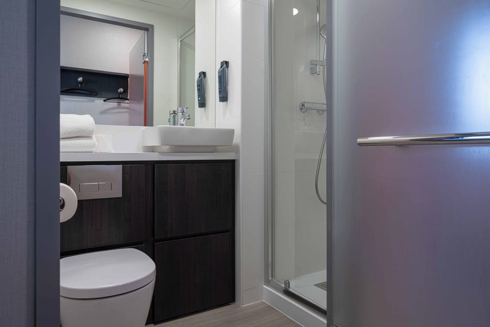 Shower, eco-friendly toiletries, hair dryer, towels