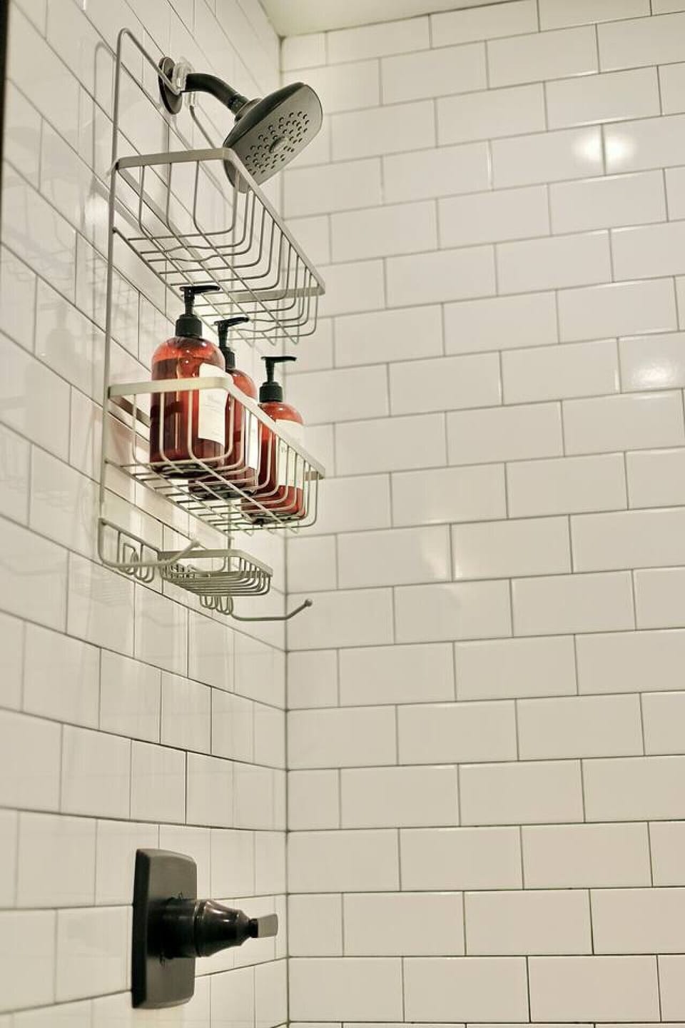 Shower Oasis: Invigorate your senses under the modern showerhead with luxurious toiletries at hand!