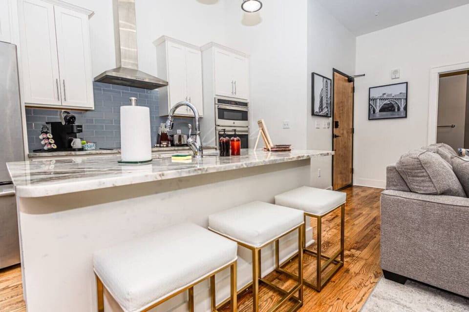 Kitchen: Entertain and whip up culinary delights with modern appliances and chic seating!