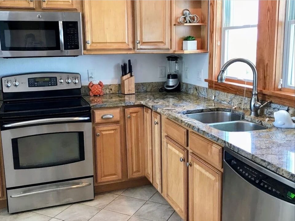 Gourmet kitchen with granite counter top, stainless steel appliances.  