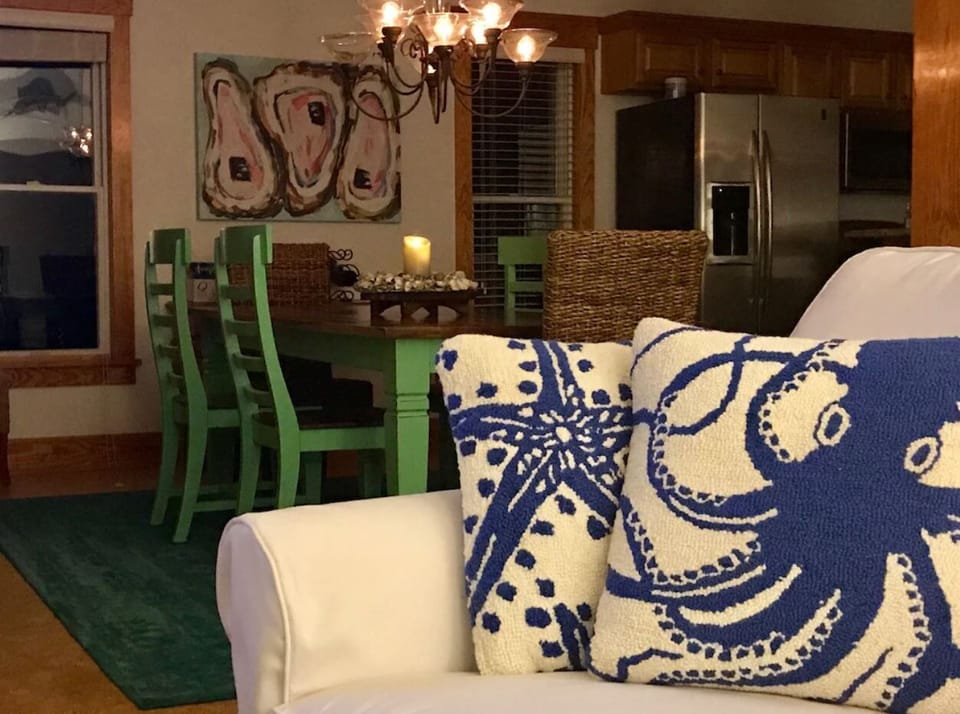 View from great room into spacious dining area with comfortable seating for six