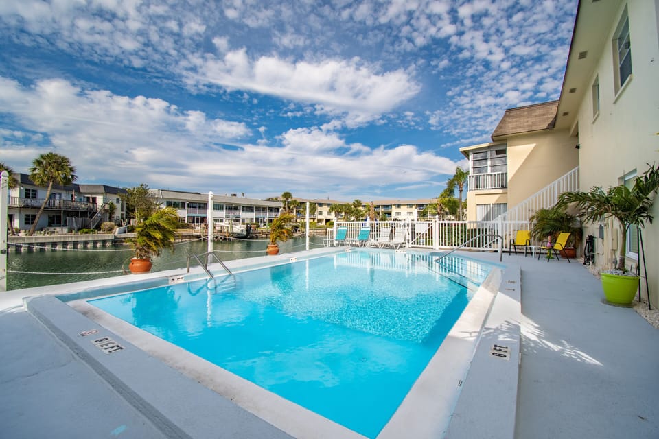 Soak up the sun on the poolside loungers and watch the boats go by.