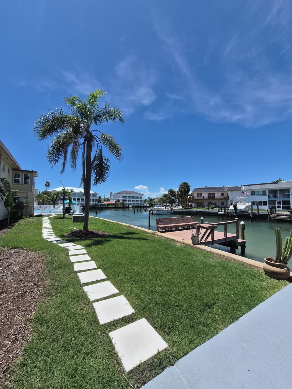 Down the front stairs, across the lawn to the dock— a few more steps to the pool