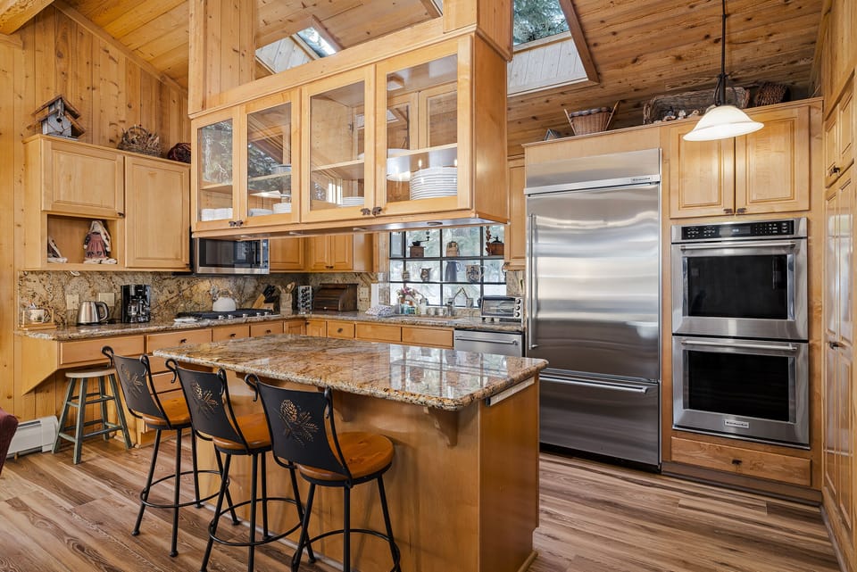 Kitchen offers and island and double ovens for cooking connivence