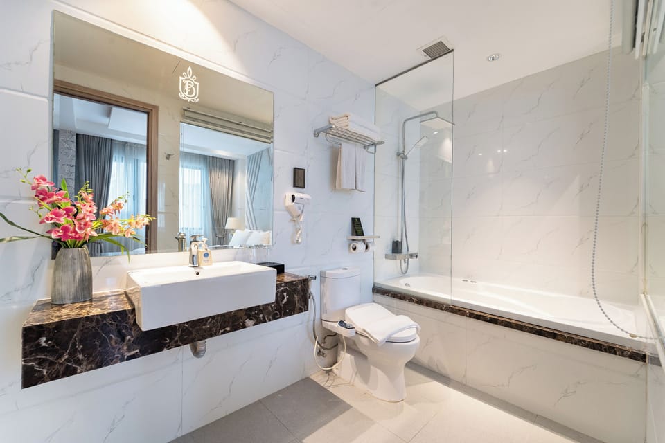 Family Room, Bathtub, City View | Bathroom | Separate tub and shower, rainfall showerhead, free toiletries