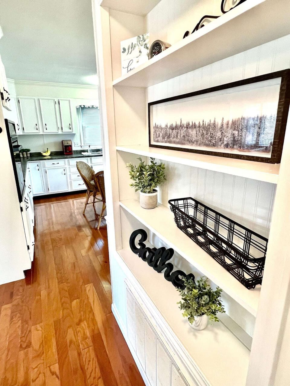 Short hall to kitchen from bedrooms/bathroom. 
