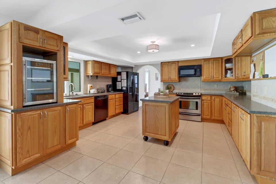 The spacious kitchen has abundant cabinet and counter space - great for families who like to cook together.