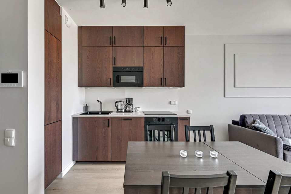 Executive Apartment | Private kitchen | Full-size fridge, stovetop, dishwasher, coffee/tea maker