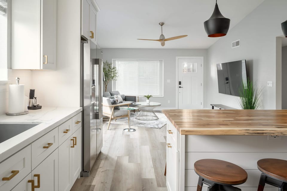 The stylish kitchen opens directly to the living room/front door. Great for game day or entertaining.