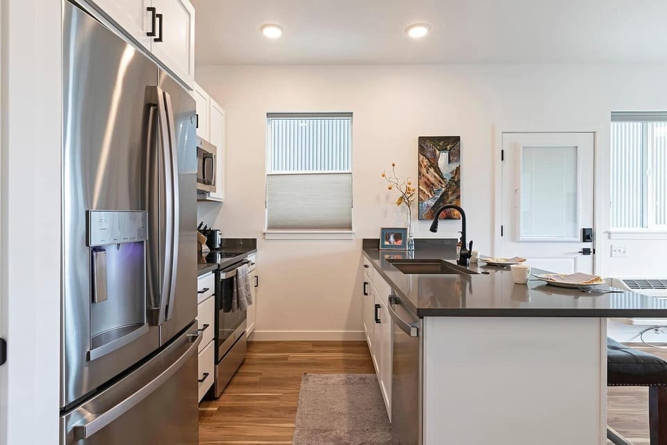Laundry area view into kitchen
