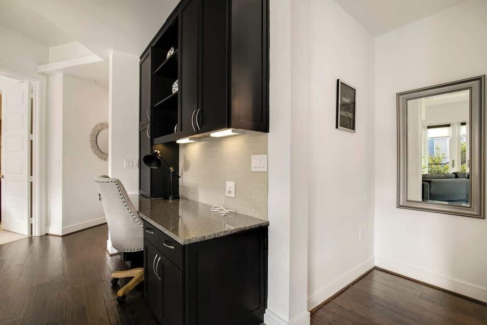 Stylish workspace with sleek furniture and natural light for productivity!