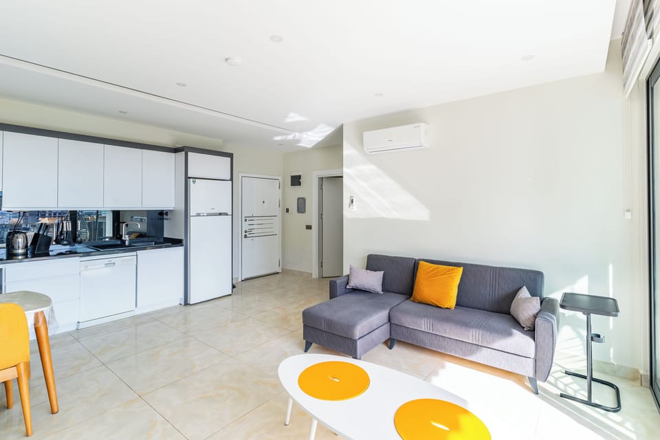 The living room and open kitchen