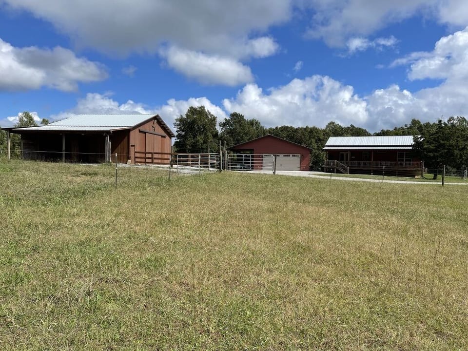 House, garage, and barn from west-side pasture. Easy turn-around for trailers.