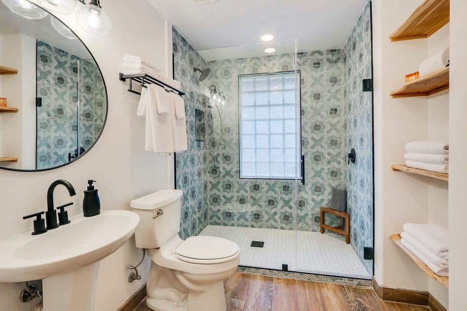 Attached bathroom with walk-in shower.