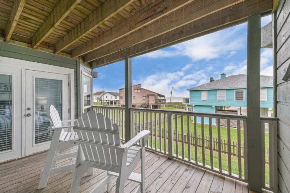 Covered balcony shared by both bedrooms! 
