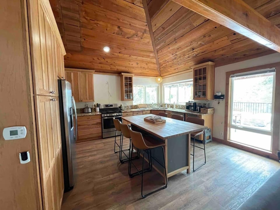 Kitchen with white oak island for eating and playing games.