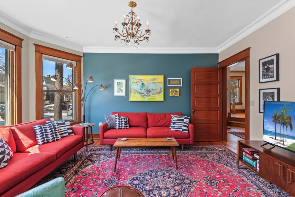 Sunshine-filled living room ideal for relaxing or gathering together.